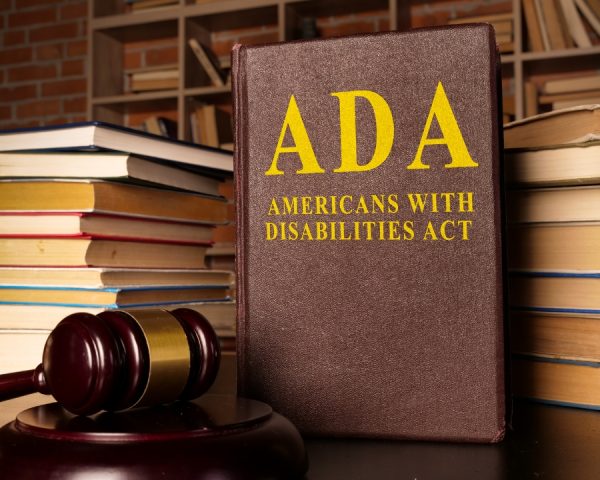 Gavel and Americans with Disabilities Act ADA book with documents.