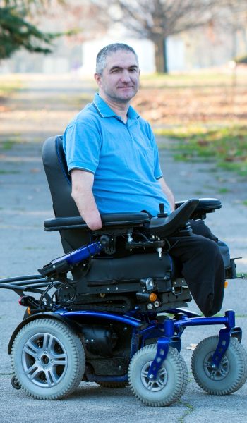 Man in electric wheelchair.